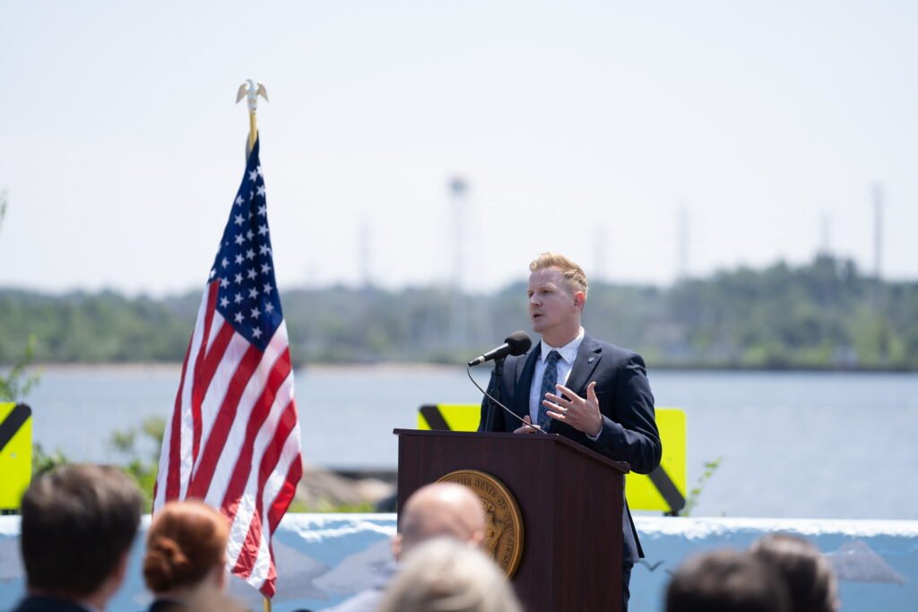 LaTourette addressing audience at climate resilience infrastructure funding announcement.